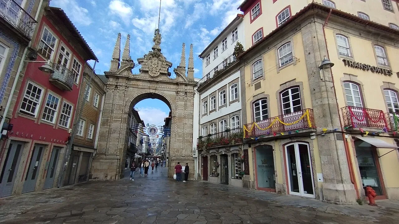 The Arco da Porta Nova framing a street in Braga.