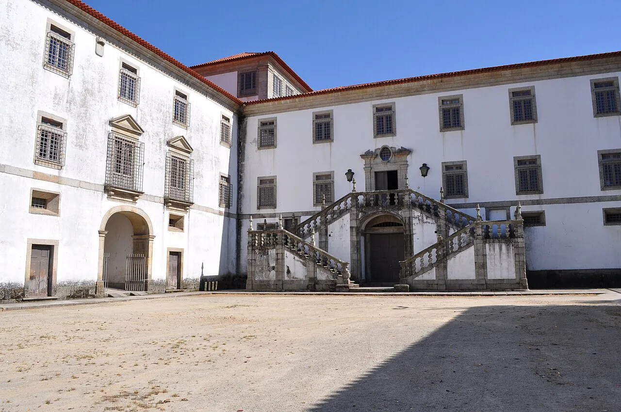 A courtyard and staircase at the Monastery of Arouca.