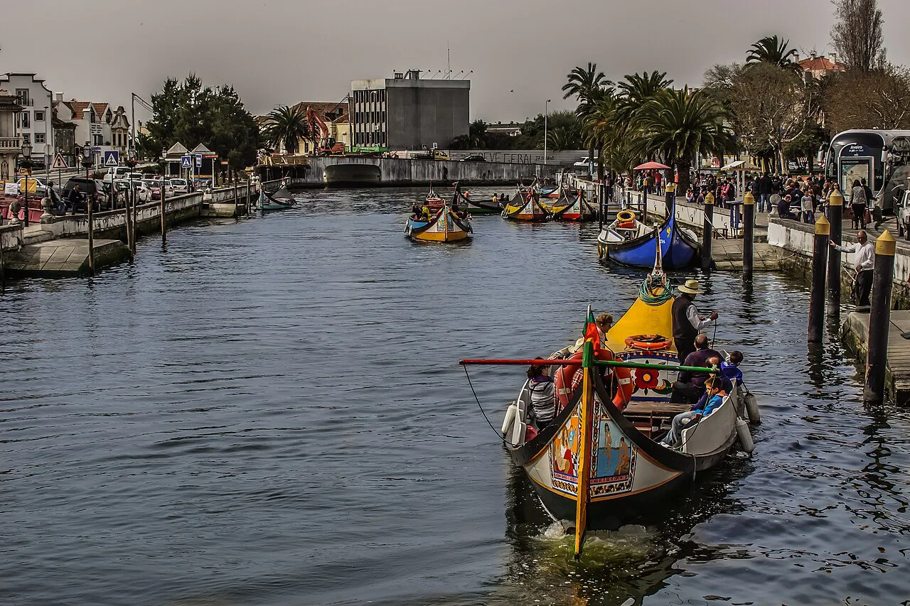 Moliceiro boats on a canal in the centre of Aveiro.