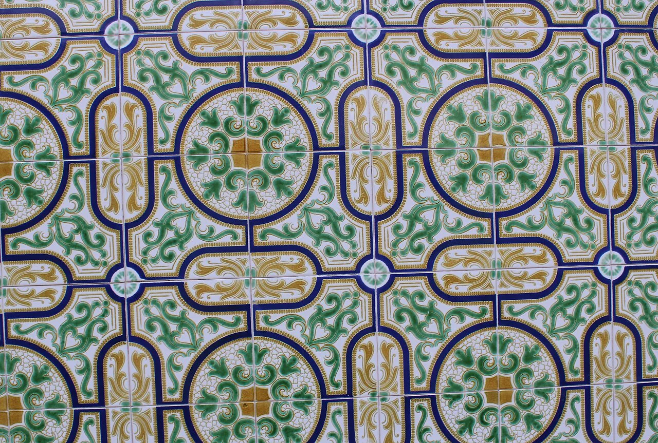 Patterned green and blue azulejos on a wall in Aveiro.