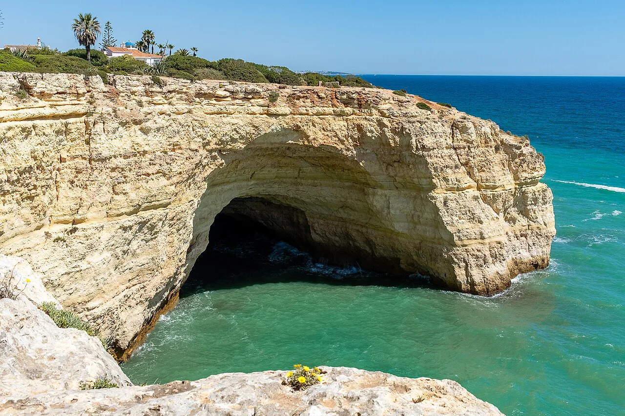 A sea cave on the clifftop trail between Carvoeiro and Benagil in the Algarve.