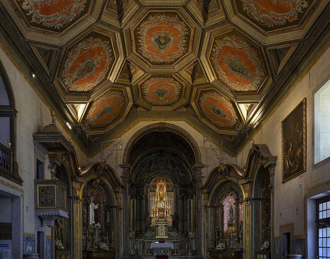 The altar and painted ceiling of the Igreja Paroquial de São Pedro in Ericeira.