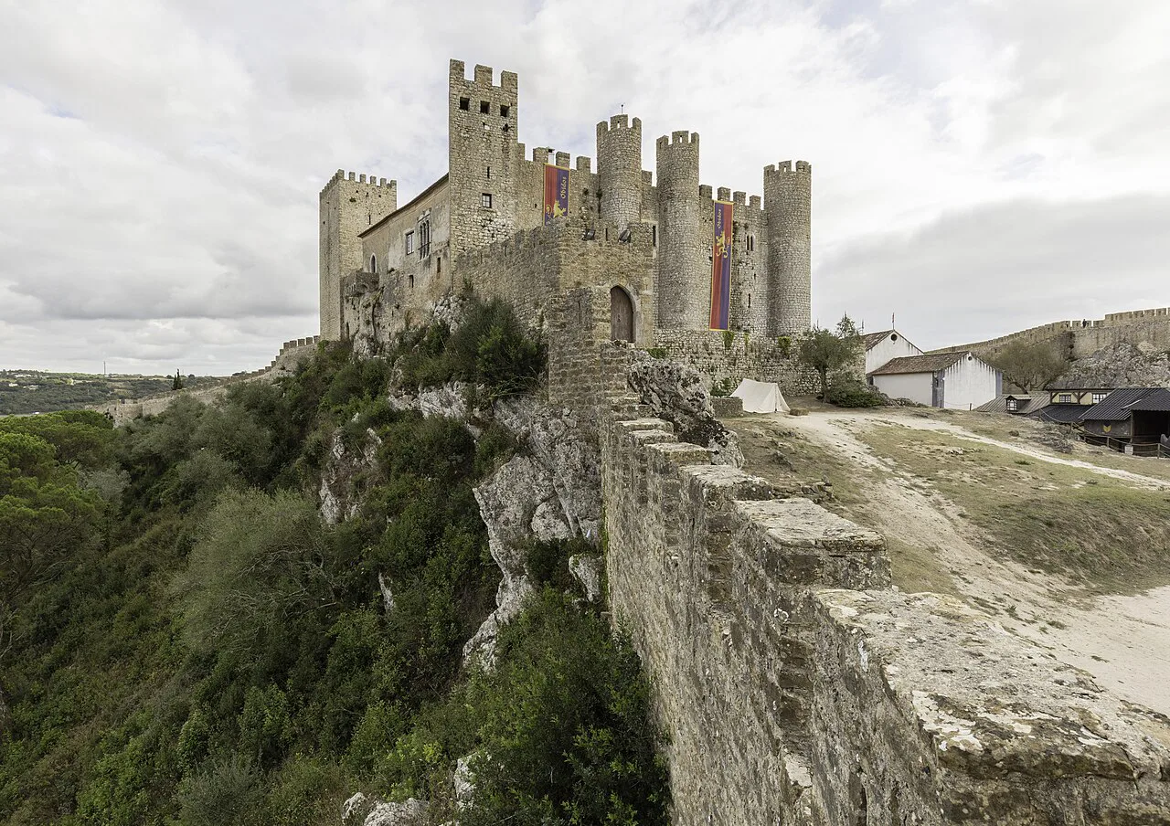 The medieval castle of Óbidos above its town walls.