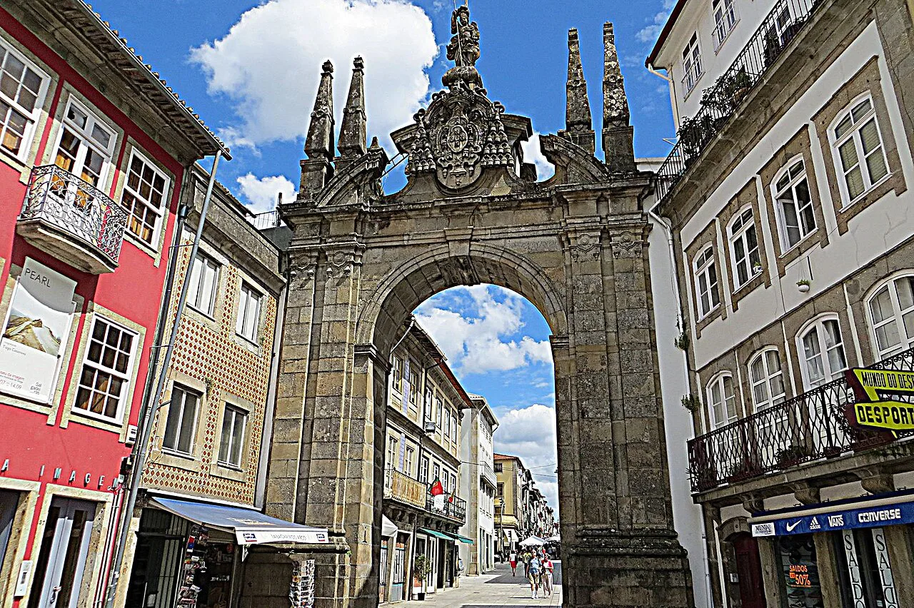 The Arco da Porta Nova framed by old-town buildings in Braga.