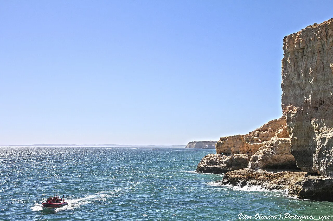 A boat passing the cliffs at Algar Seco, near Carvoeiro.