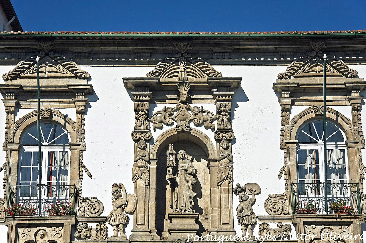 The carved stone facade of the Convento de Santa Clara in Guimarães.