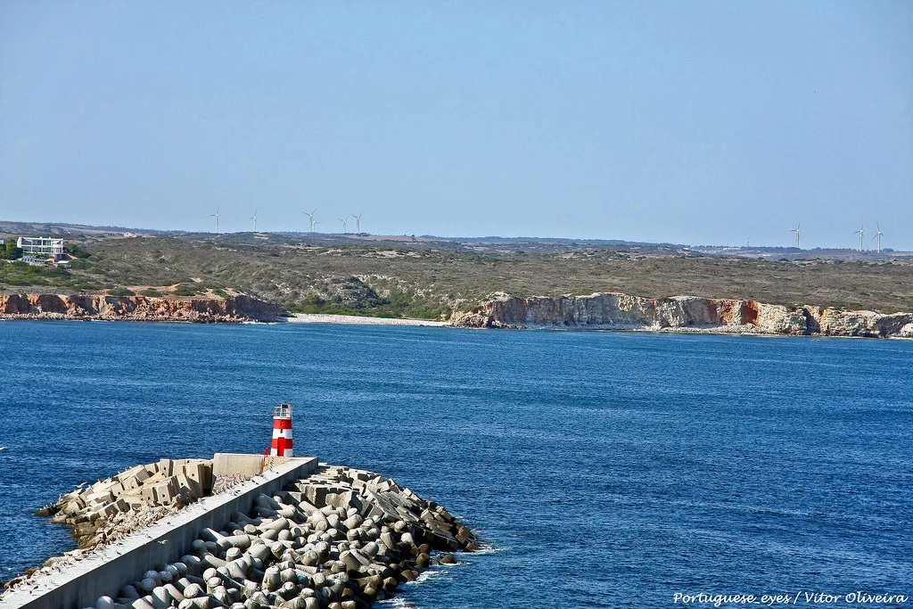 The breakwater and harbour light of the fishing port at Sagres.