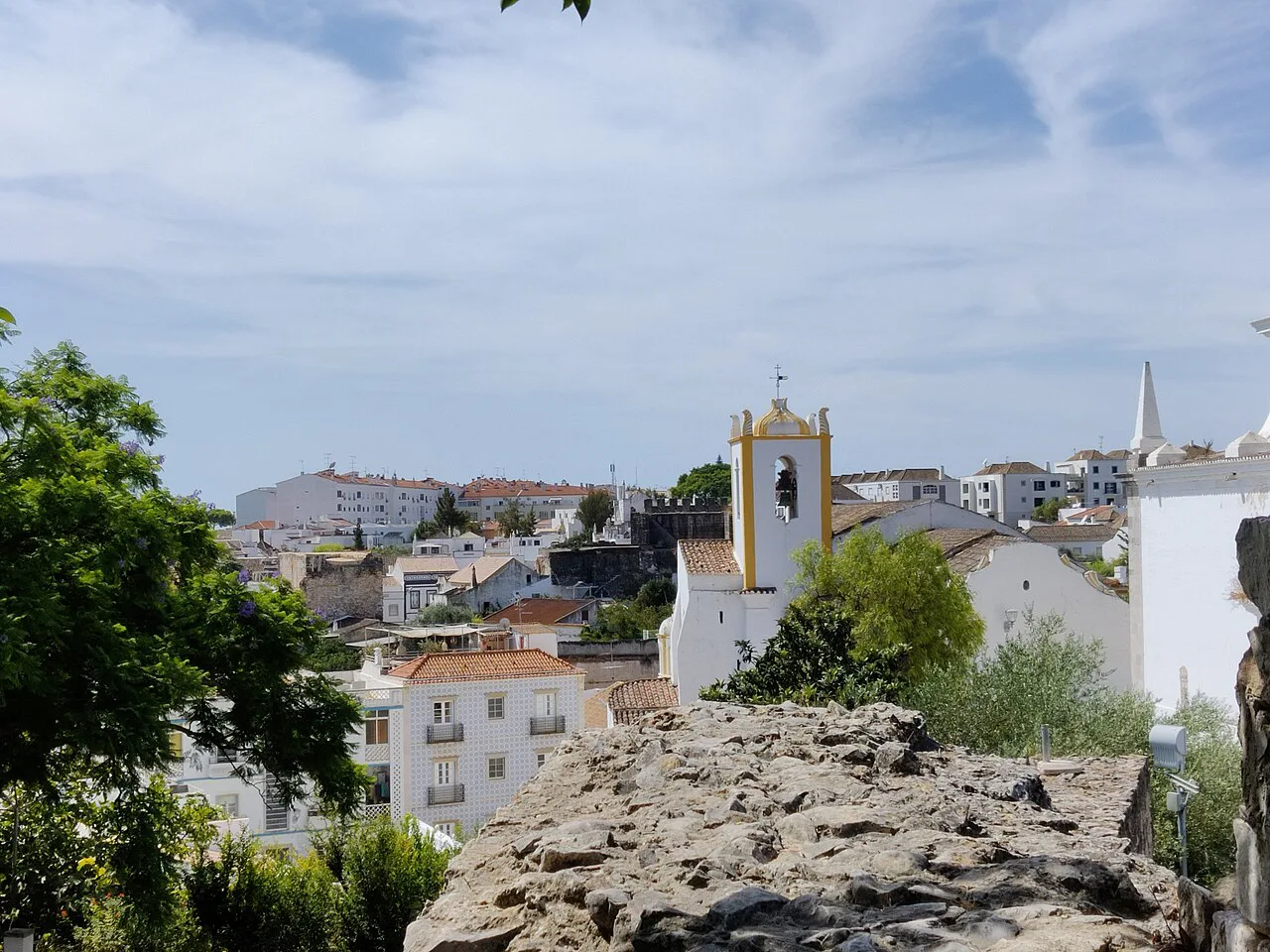 Rooftops and a church tower in Tavira.