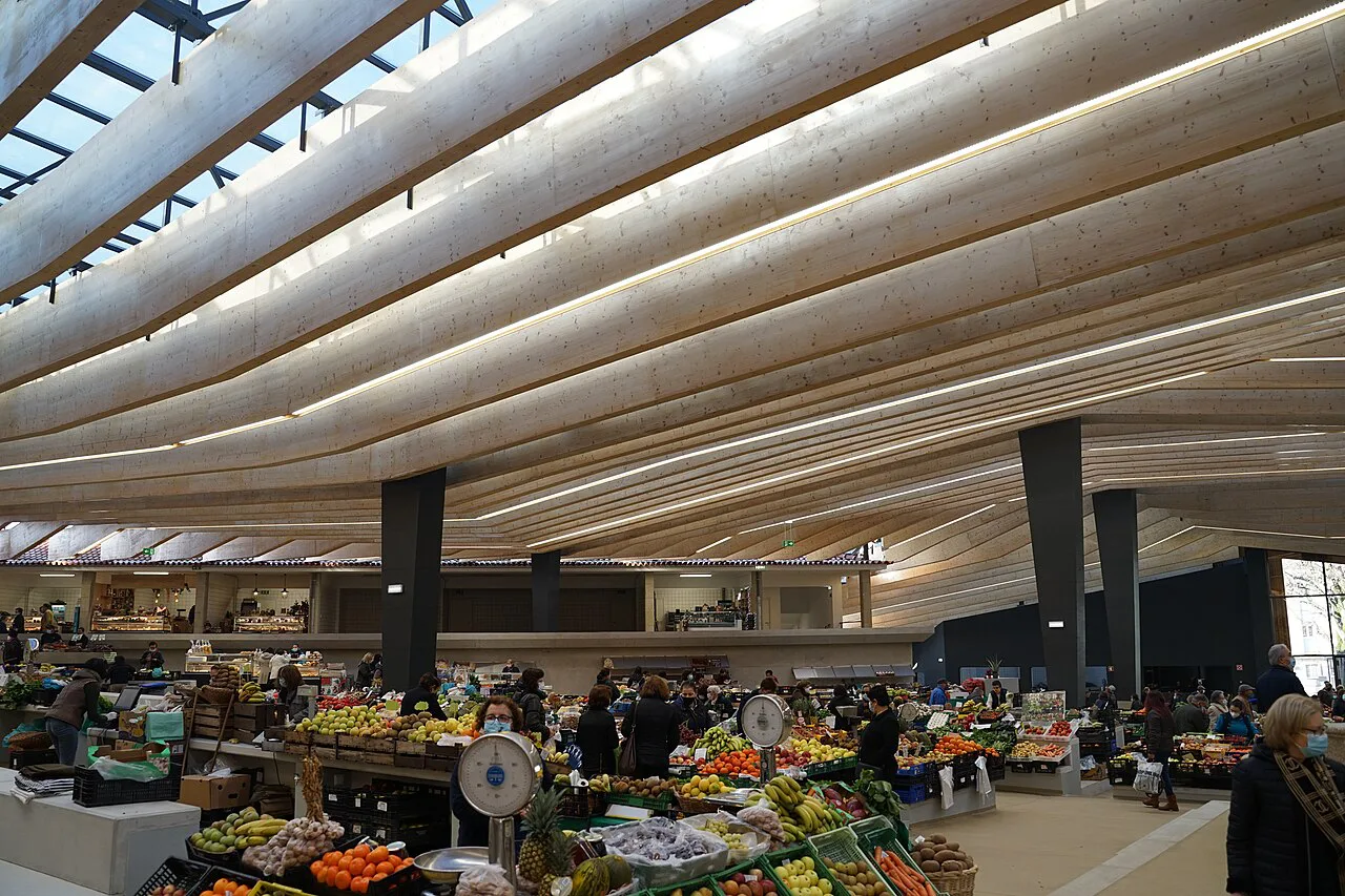 Market stalls under the slatted roof of the Mercado Municipal de Braga.