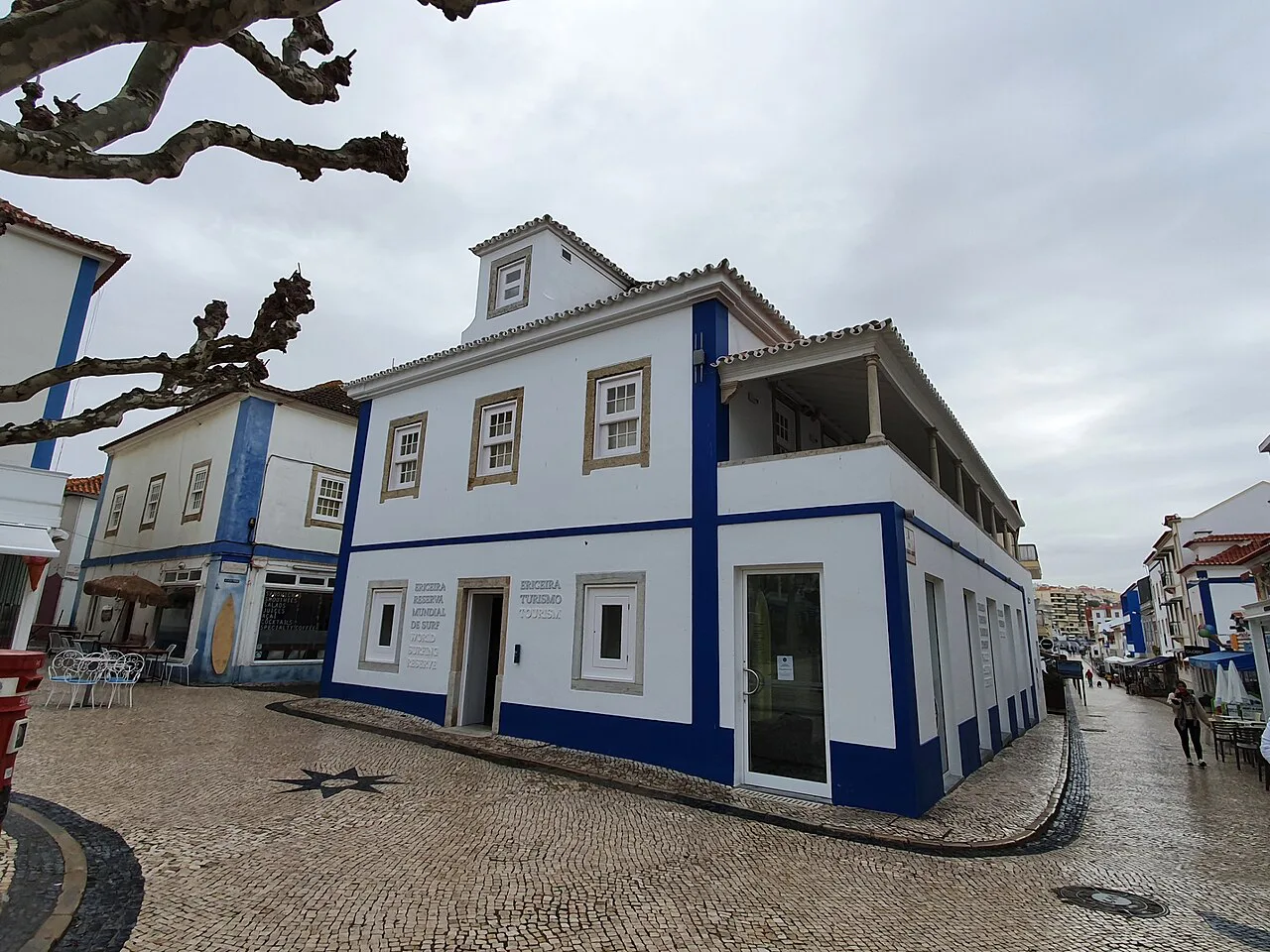 Blue-trimmed buildings on Praça da República in Ericeira.