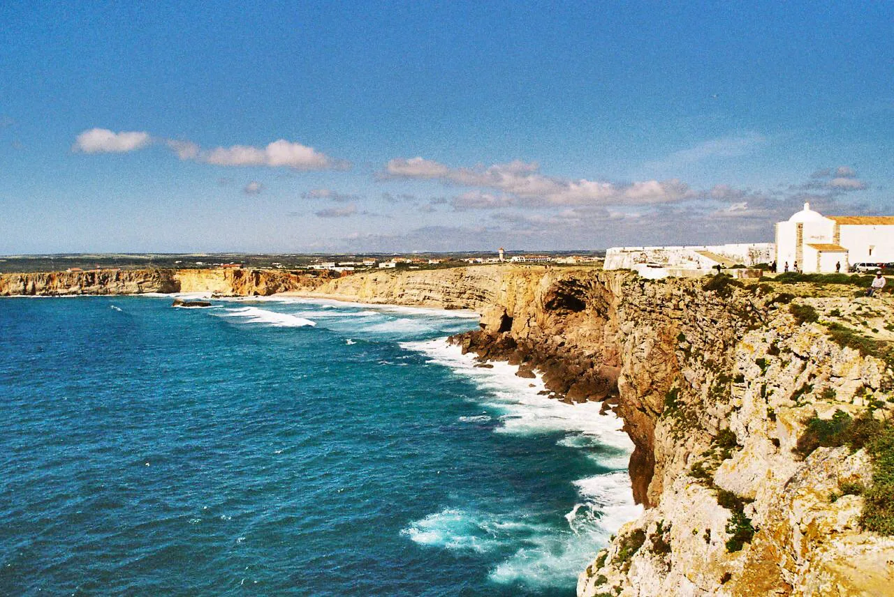 Waves breaking below the cliffs at the Fortaleza de Sagres.