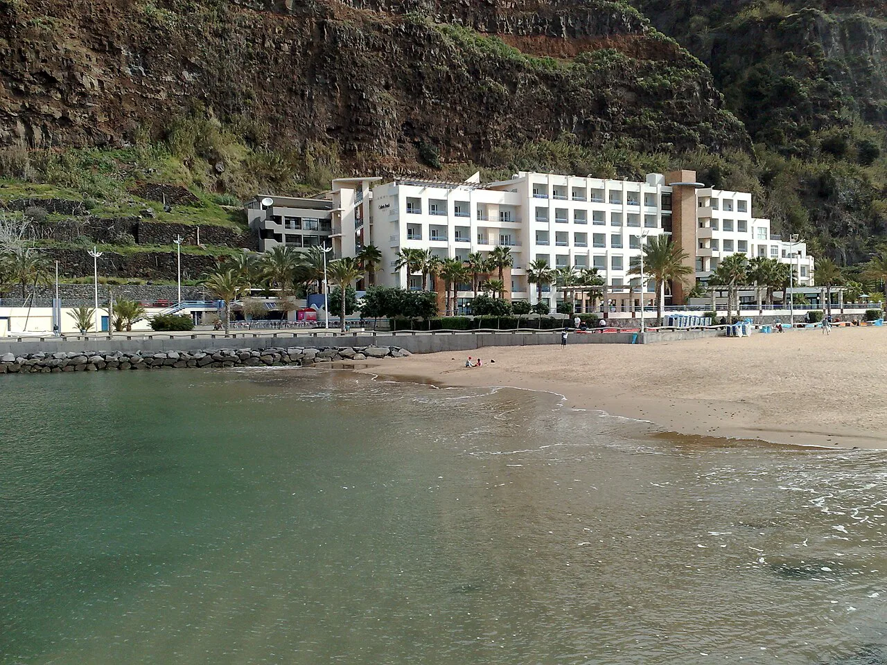 Calheta Beach Hotel seen from the sea wall in Calheta, Madeira.