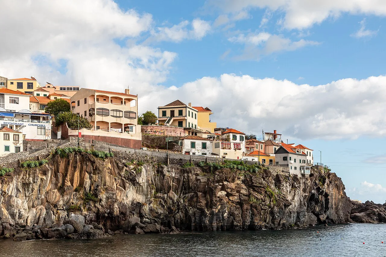 Houses on the cliff above the harbour at Câmara de Lobos, Madeira.