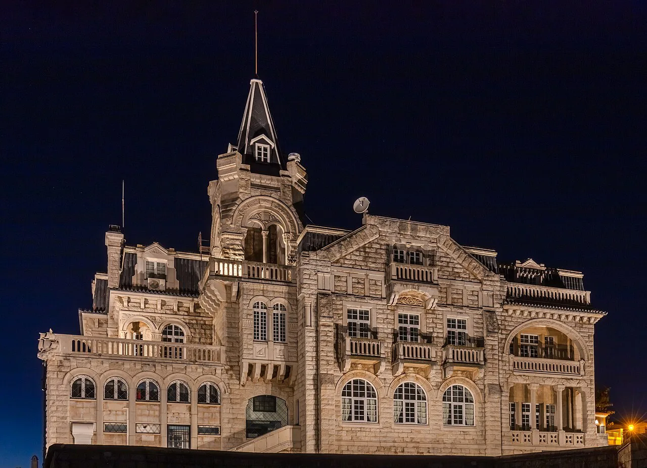 Palacete Seixas in Cascais, lit up at night.