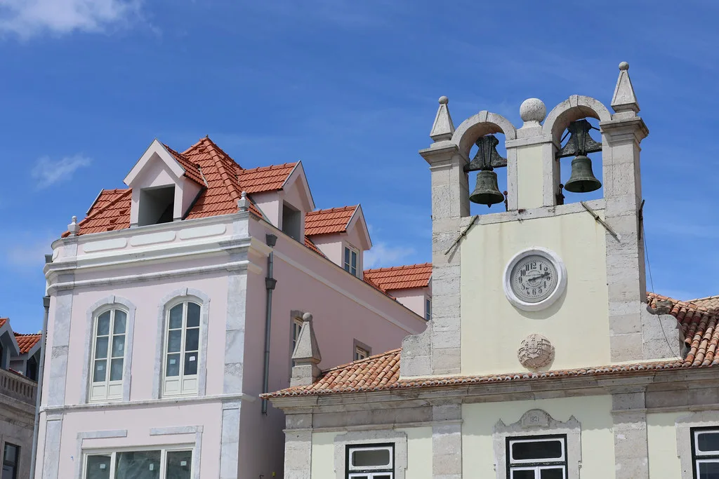 A historic building with a clock and bell tower in Cascais.