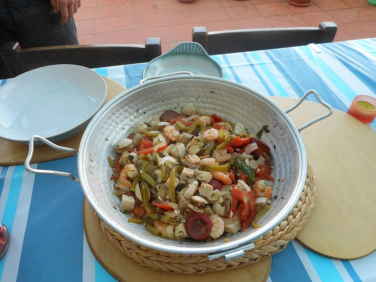 Clams cooked in a cataplana with prawns, pork and peppers.