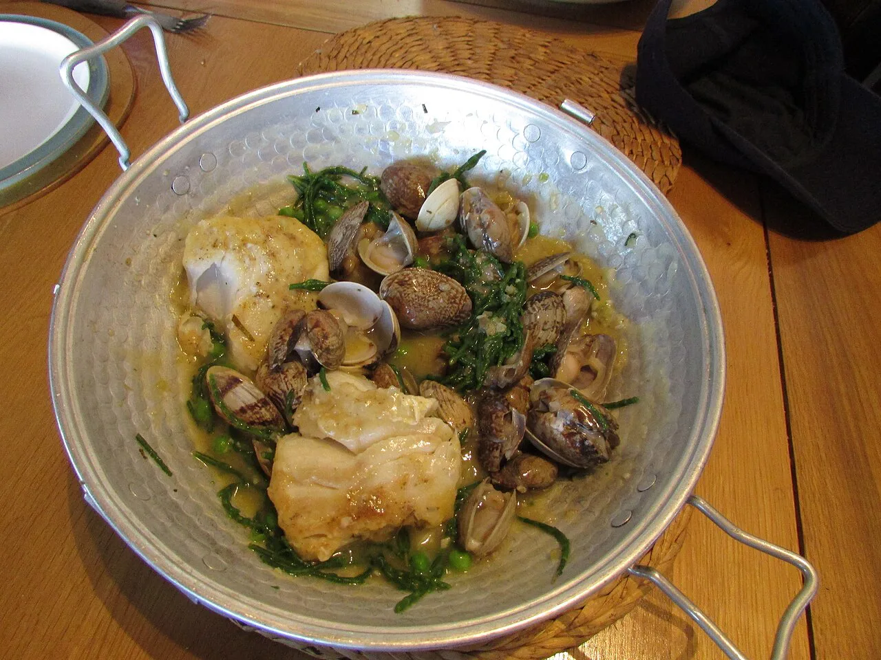 Cod, clams, peas and samphire cooked in a traditional cataplana.