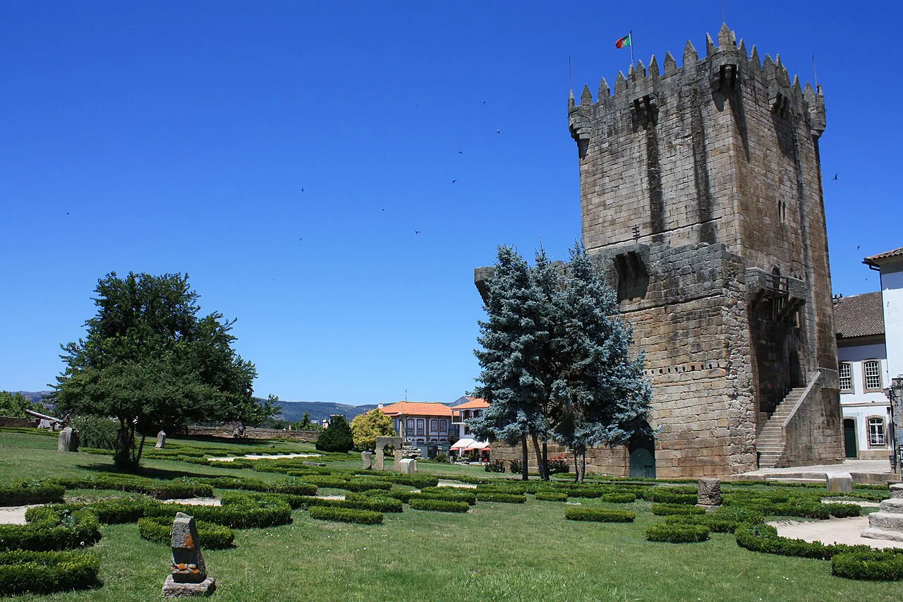 The keep of Chaves Castle above its formal garden.