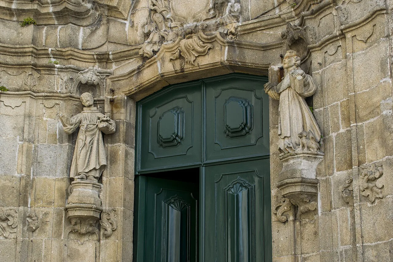 The carved stone portal of the Igreja de São Domingos in Guimarães.