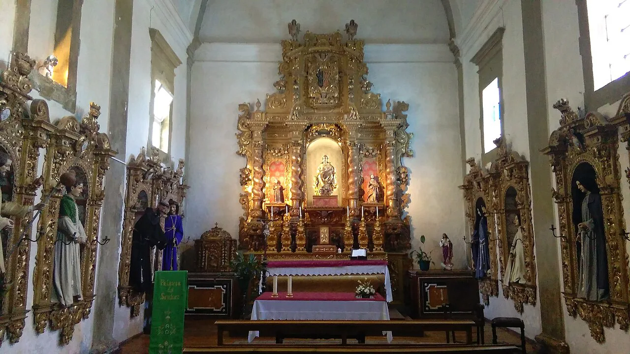 A chapel with statues of saints used in Holy Week processions inside the Church of São Francisco in Tavira.