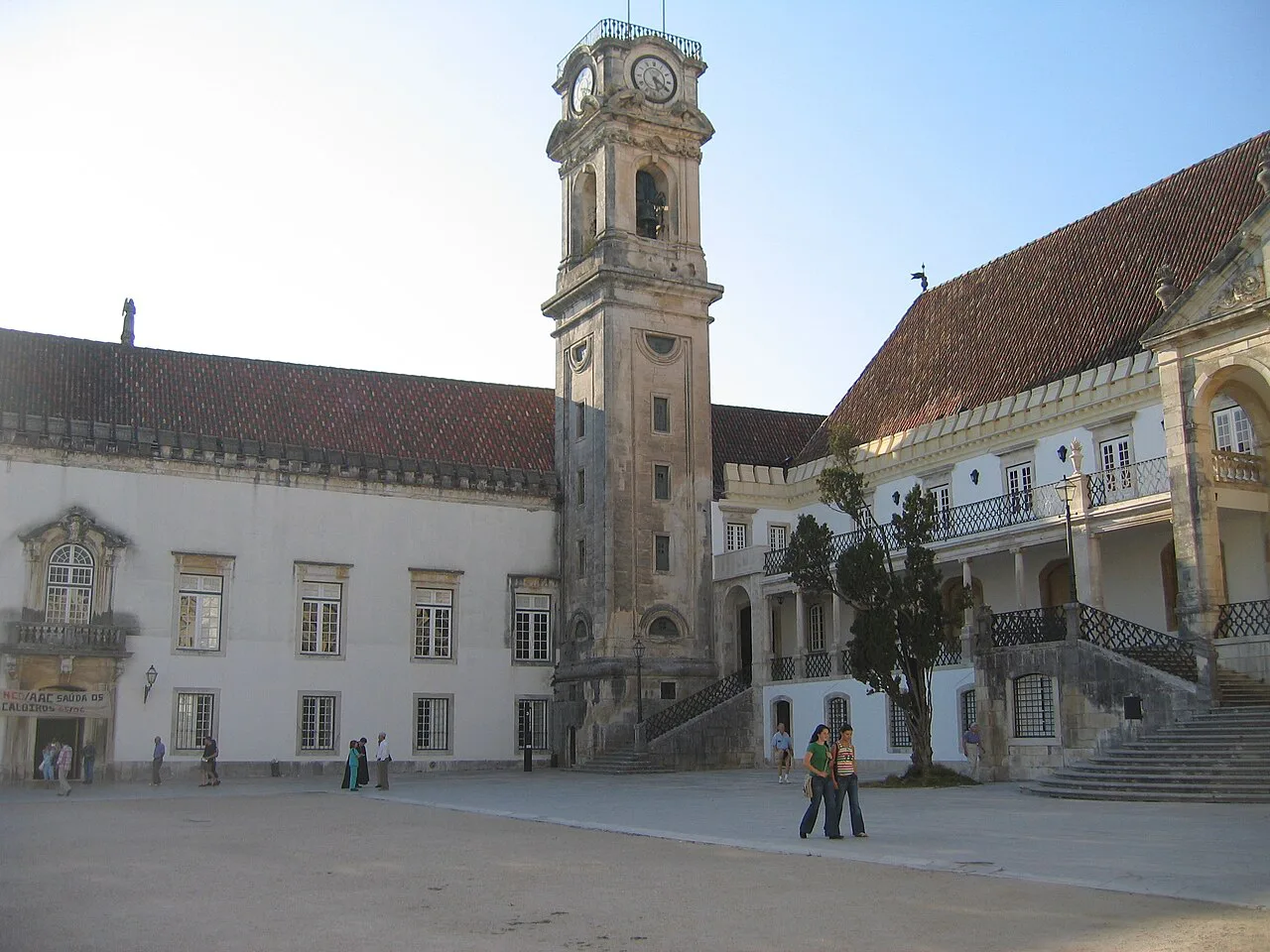 The clock tower of the University of Coimbra rising above the university courtyard.
