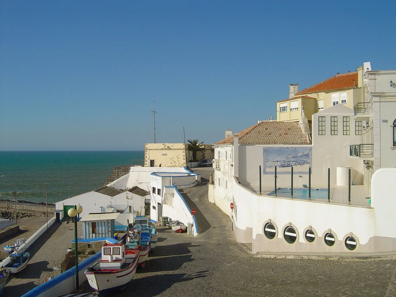 Fishing boats pulled up on the harbour slipway in Ericeira.
