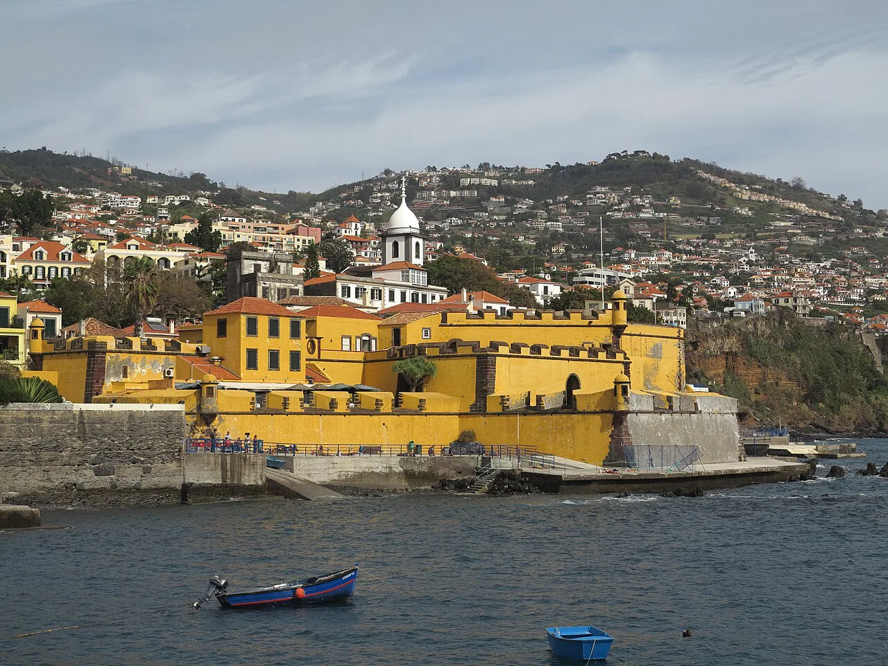 The yellow walls of the São Tiago Fortress on the waterfront in Funchal.