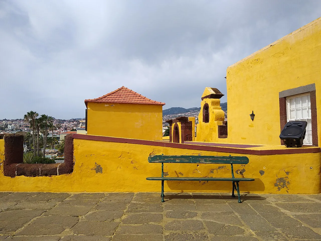 Yellow ramparts and a turret at the São Tiago Fortress in Funchal.