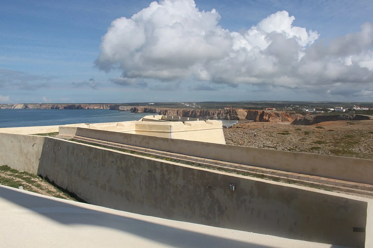 The walls of Sagres Fortress with the coastline beyond.