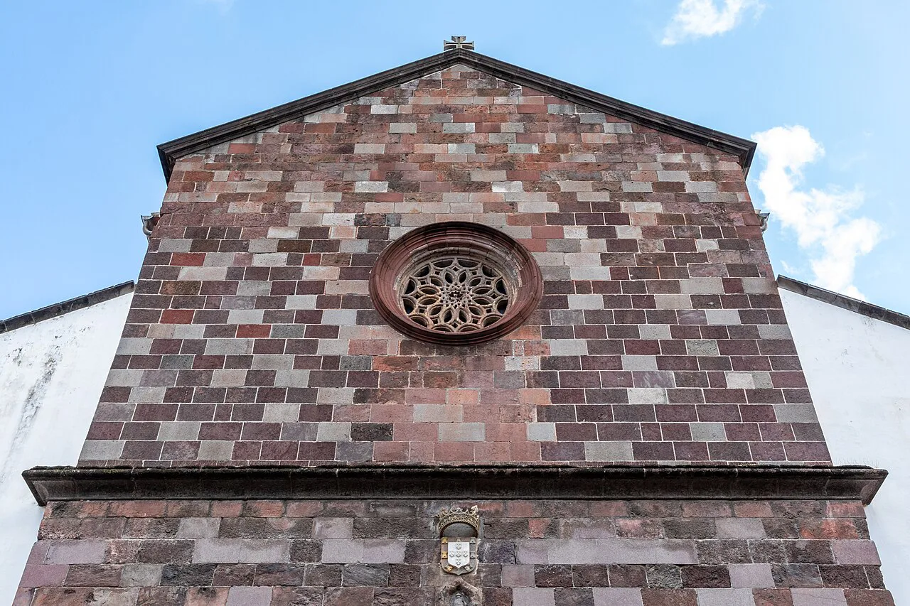 The façade and rose window of Funchal Cathedral (Sé do Funchal) in Madeira.