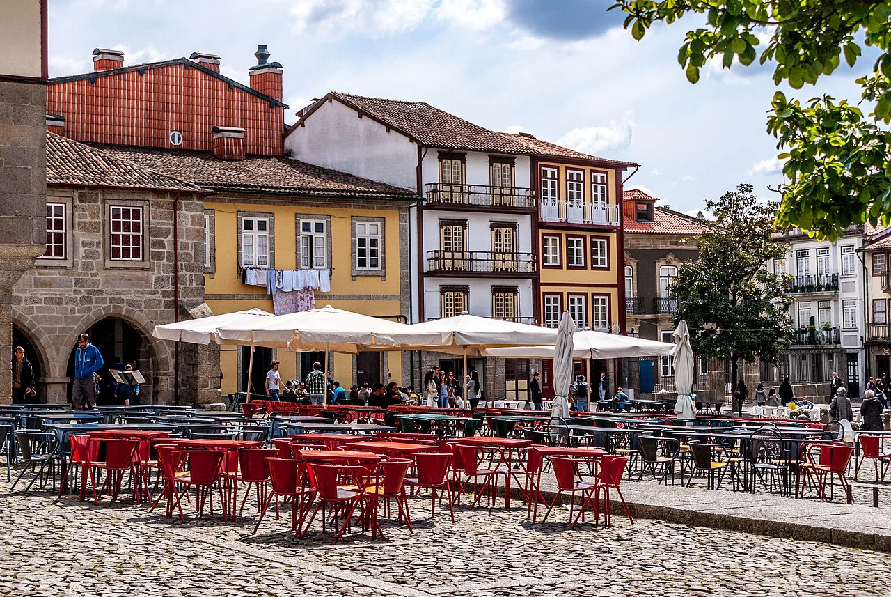 Café terraces on a square in the historic centre of Guimarães.