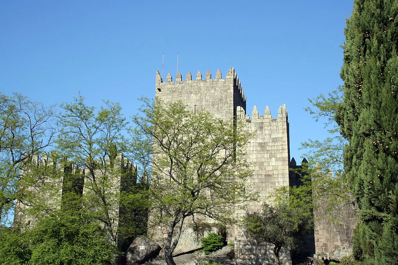 The keep of Guimarães Castle among the trees of the Sacred Hill.
