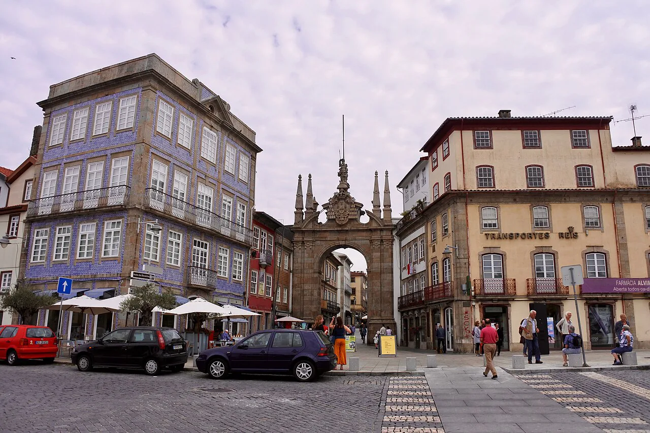 The Arco da Porta Nova seen from a street in the centre of Braga.