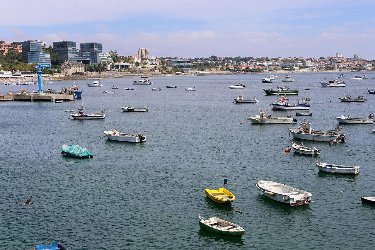 Small boats moored in the bay at Cascais.