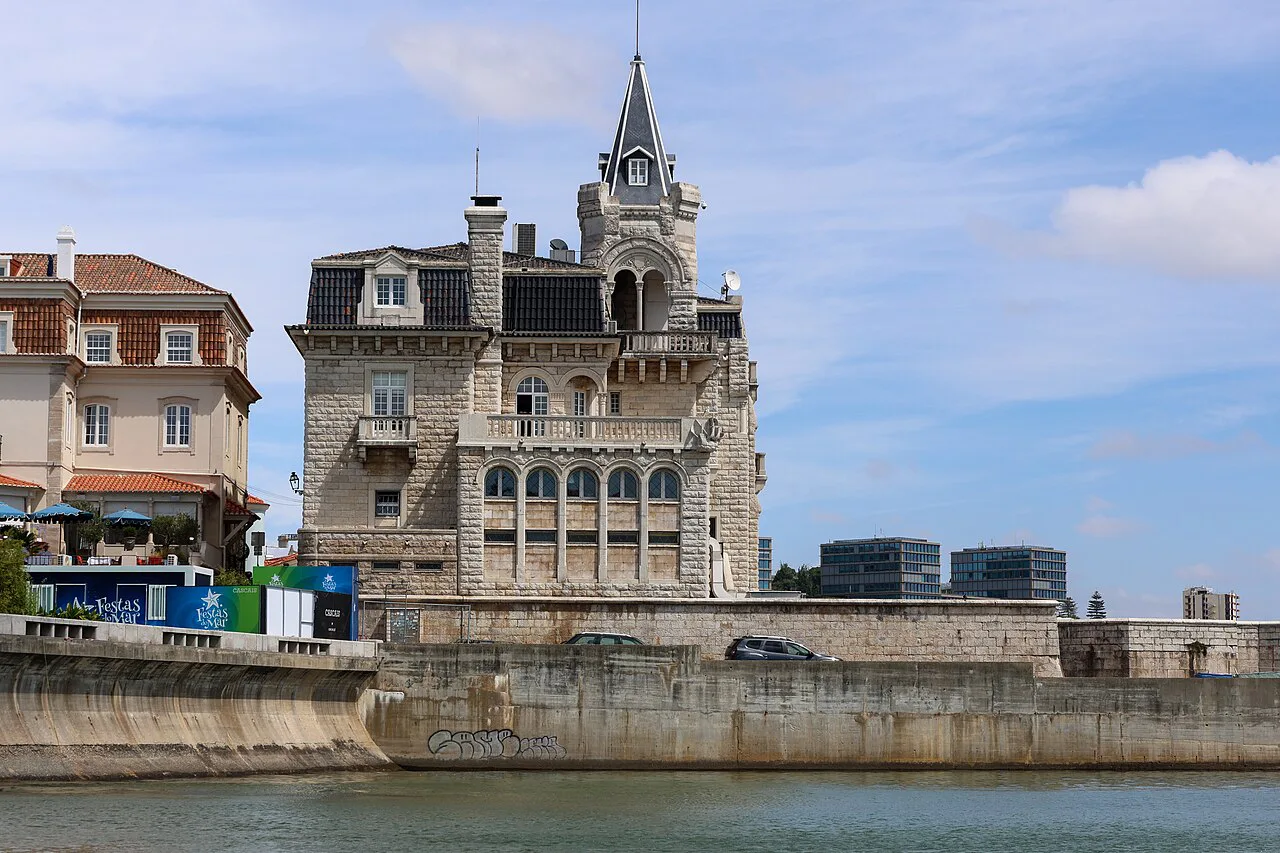 A turreted stone building on the waterfront in Cascais.