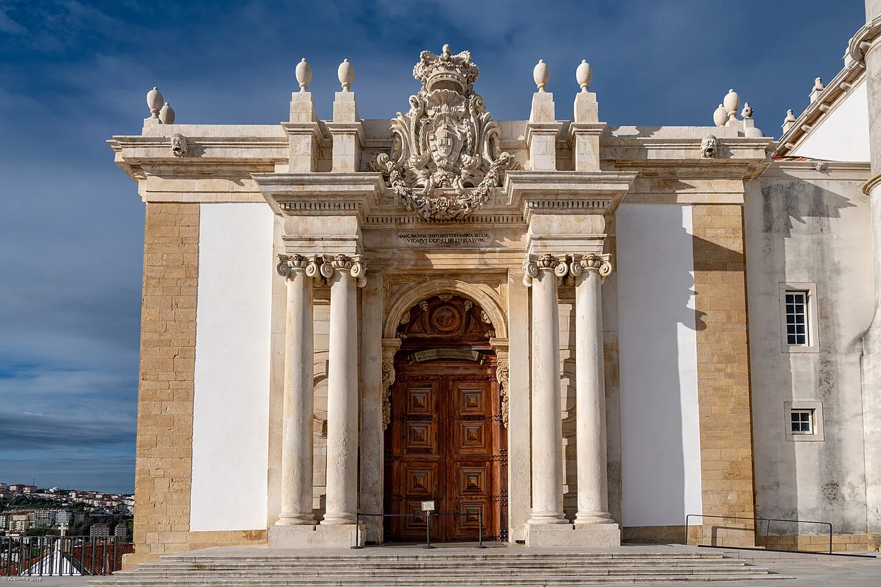 The baroque entrance of the Biblioteca Joanina at the University of Coimbra.