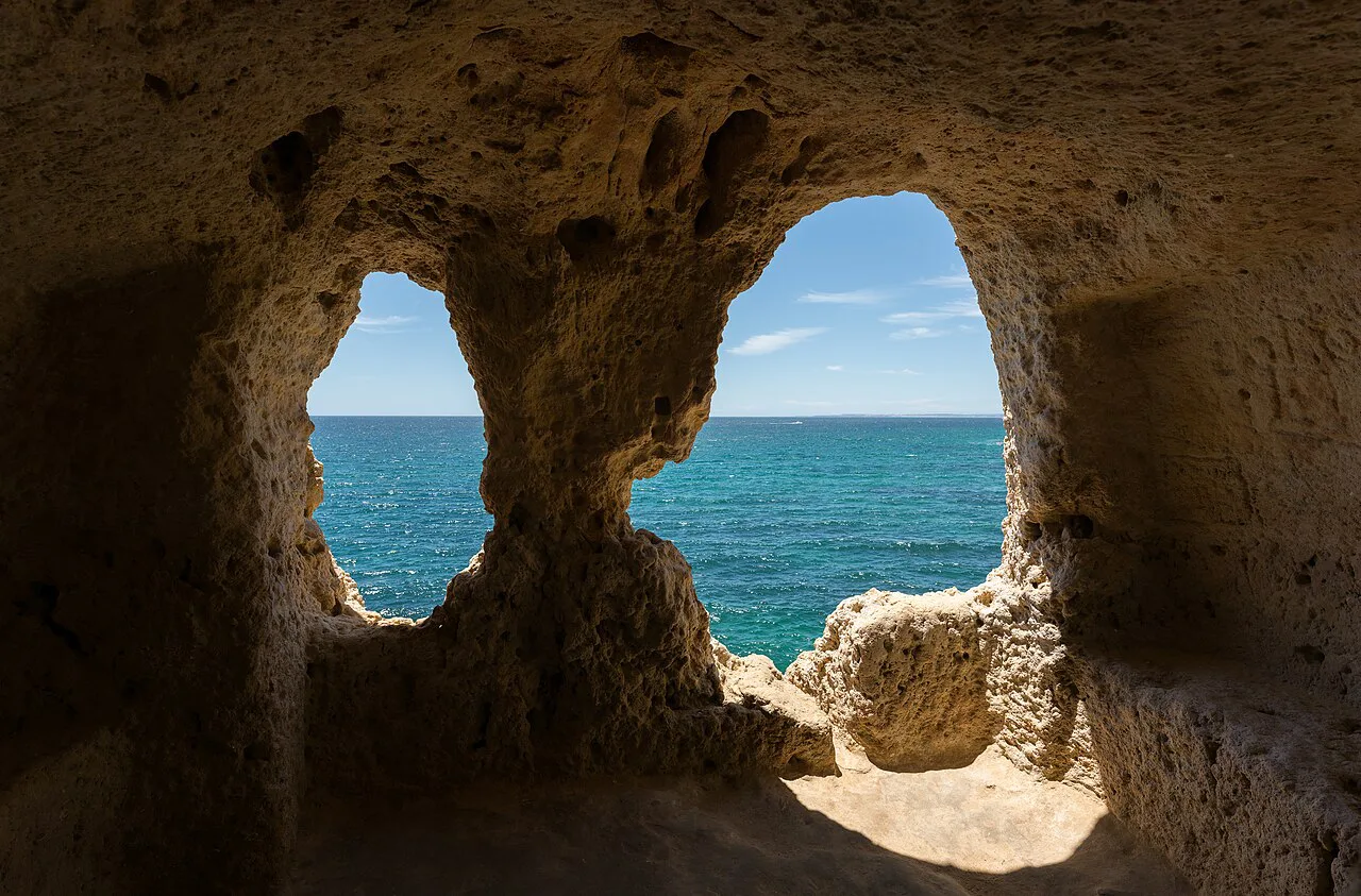 A rock arch framing the sea at Algar Seco, Carvoeiro.