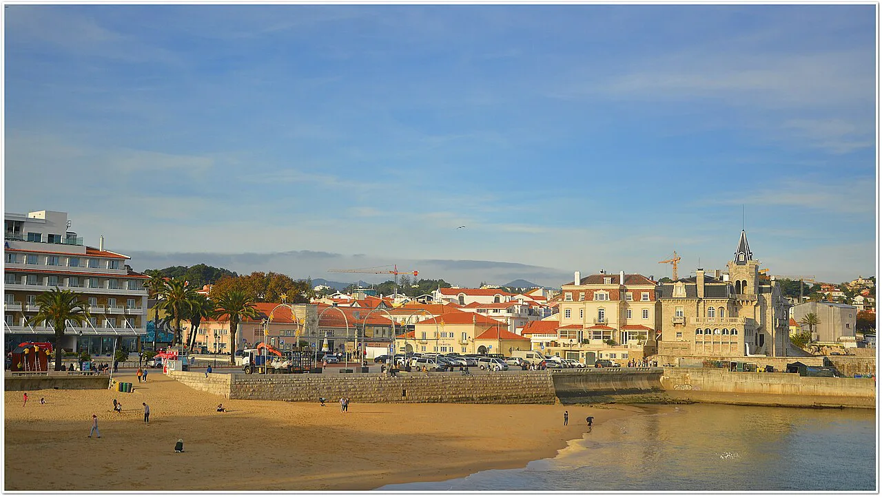 The beach and seafront of Cascais seen across the bay.
