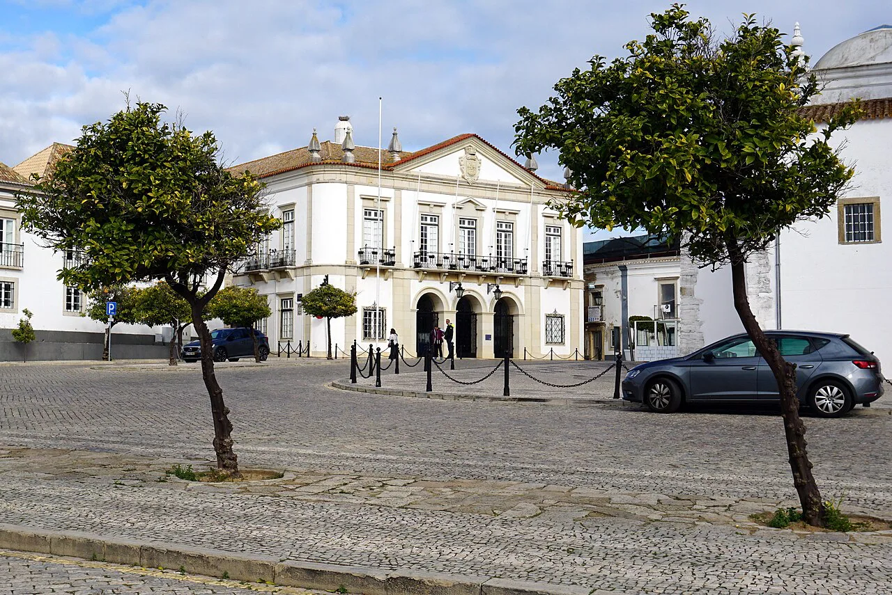 A cobbled square with whitewashed buildings in the old town of Faro.
