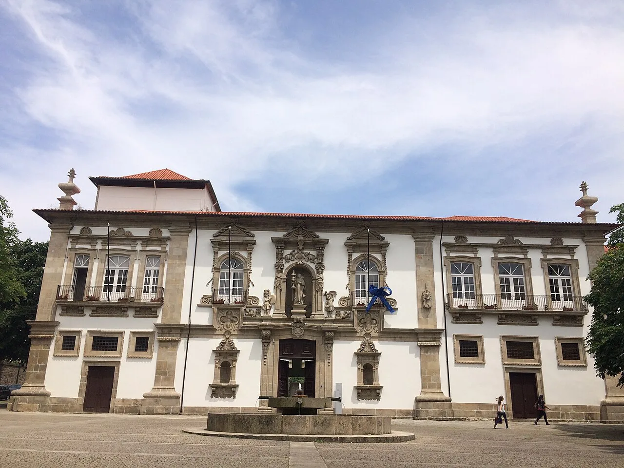 A historic white building with a stone portal in Guimarães.