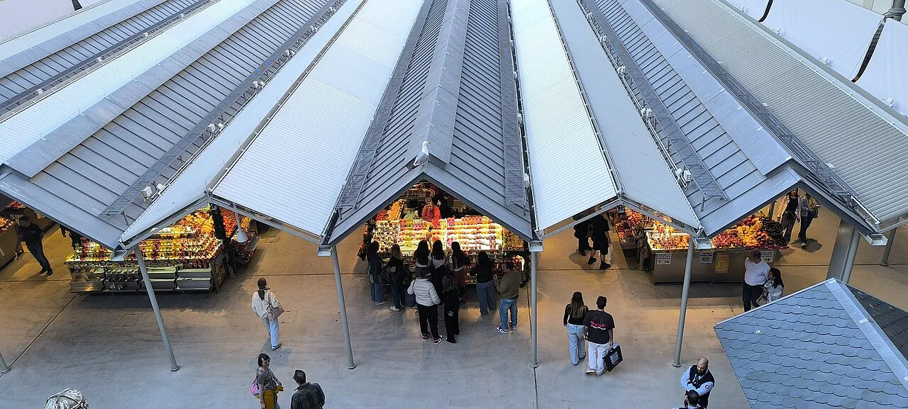 Stalls under the canopies of the Mercado do Bolhão in Porto.