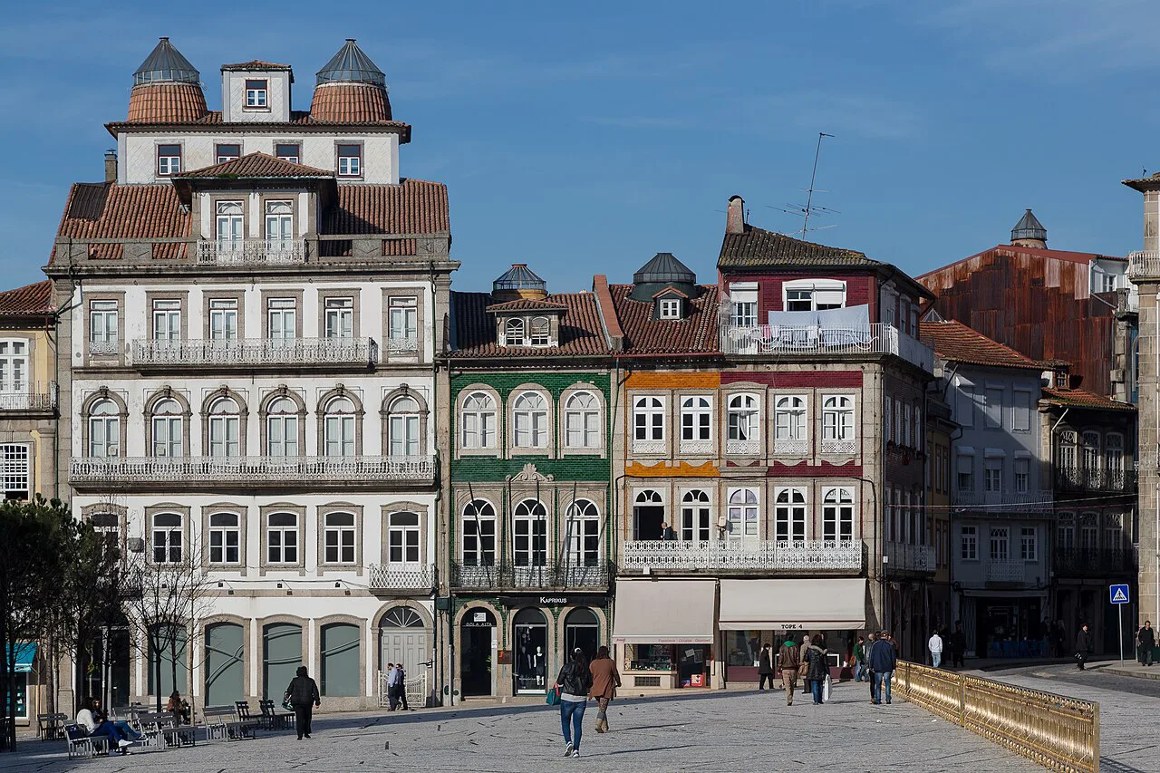 Tall tiled and windowed townhouses lining the Largo do Toural in Guimarães.