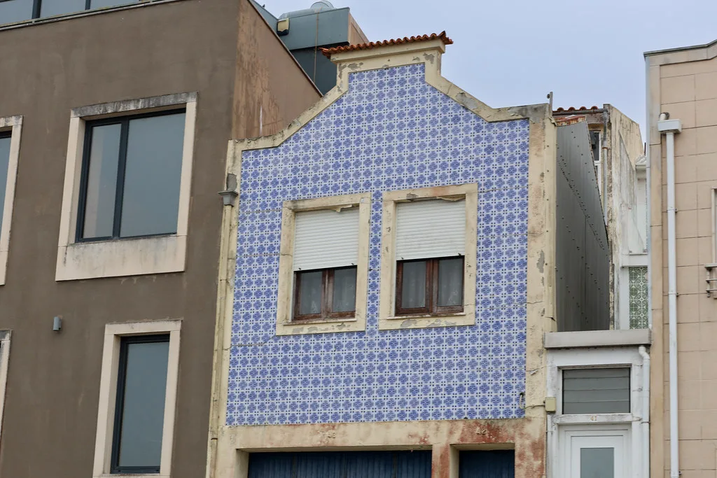 A house with a blue tiled facade in Aveiro.