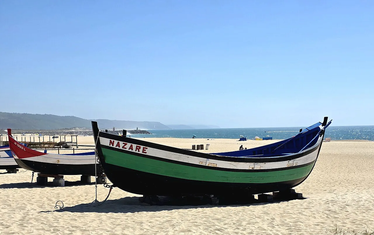 A traditional fishing boat on the beach at Nazaré.