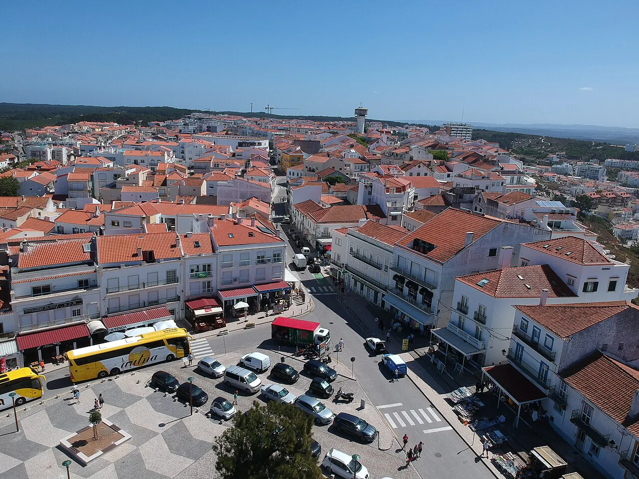 Rooftops and a square in Nazaré seen from above.