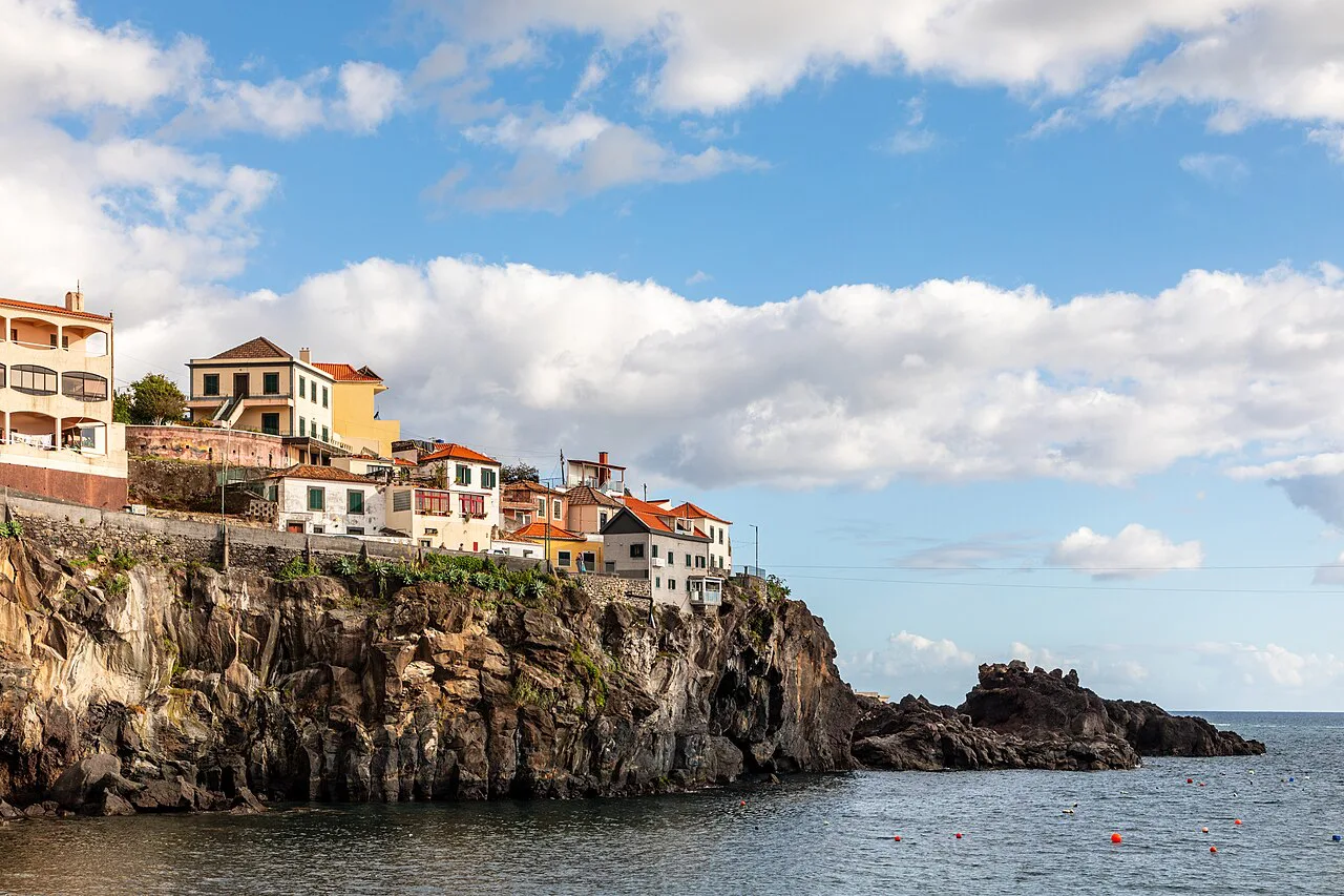 Buildings on the clifftop above the harbour at Câmara de Lobos in Madeira.
