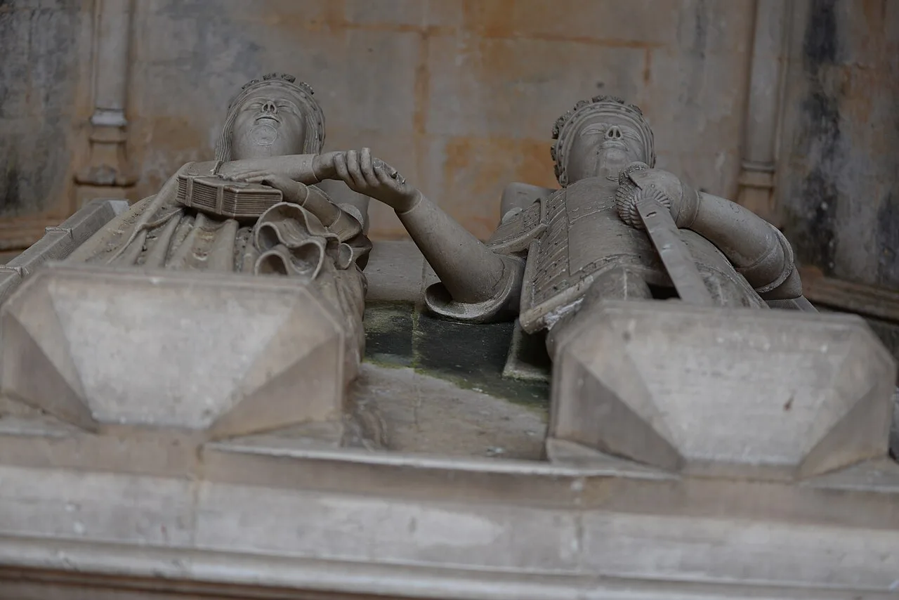 Carved stone tomb effigies inside the Monastery of Batalha.