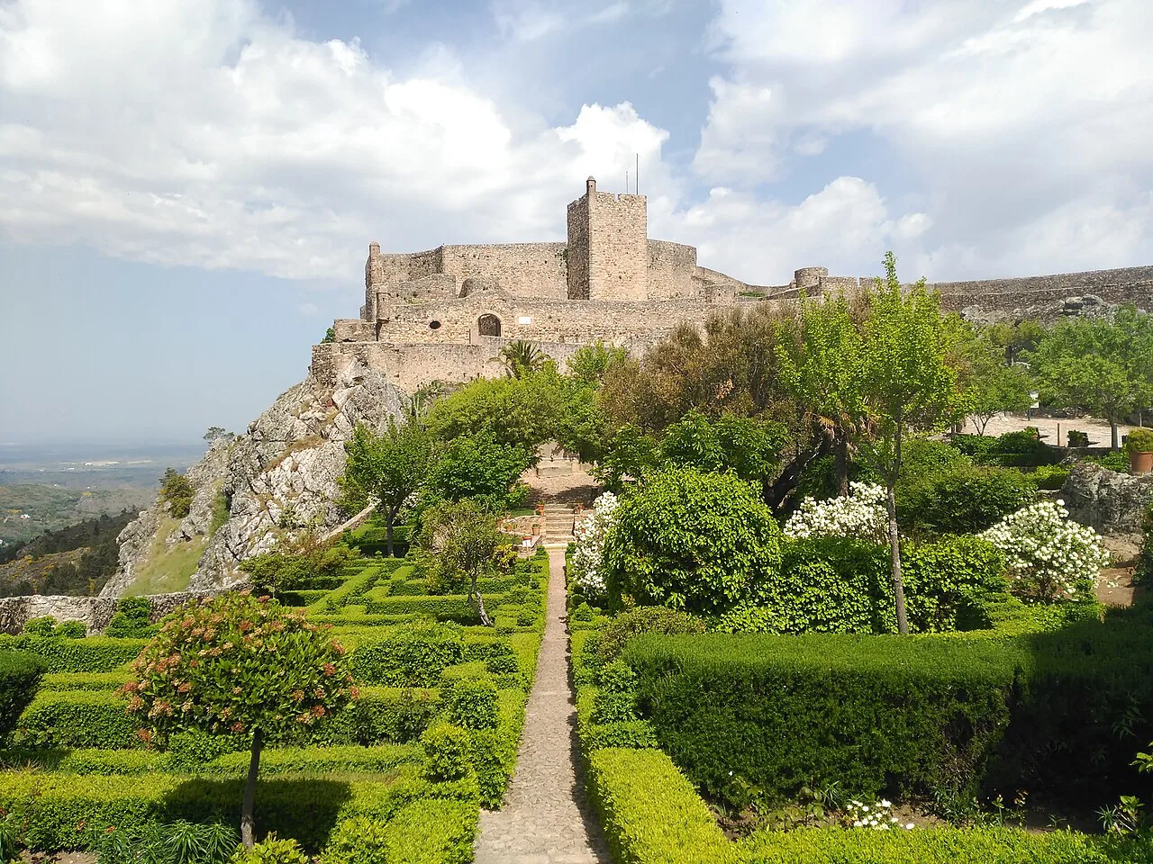 Marvão Castle on its rocky ridge above formal gardens in the Alentejo.