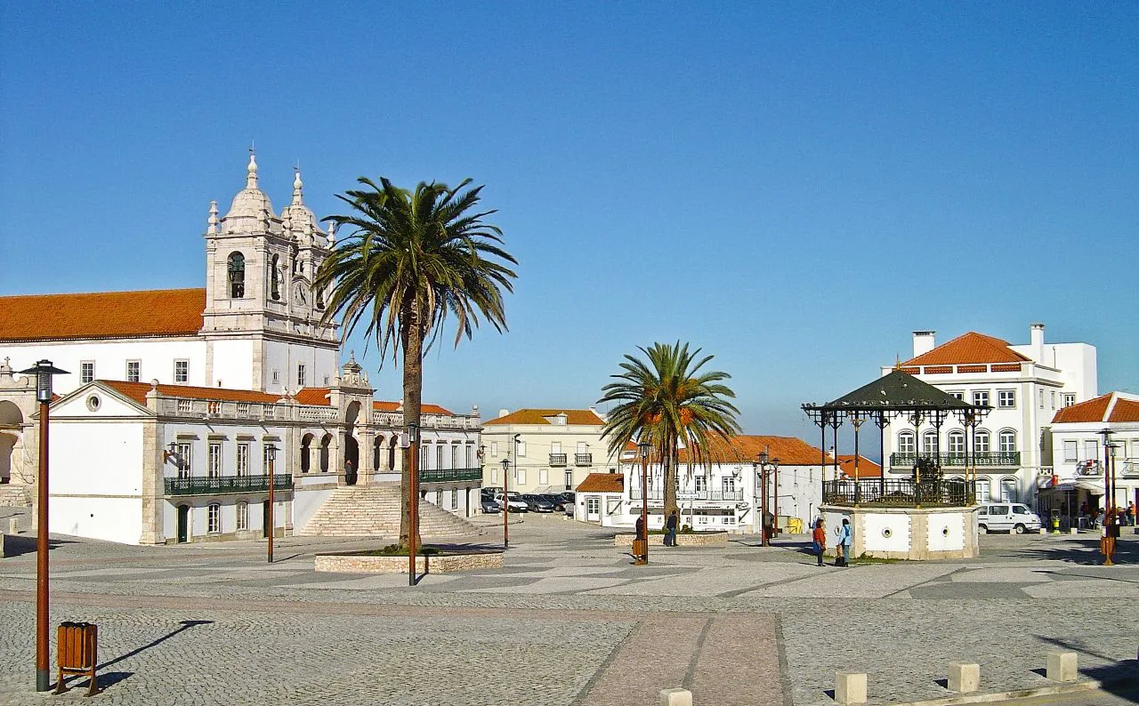 The church and palm-lined square at Sítio in Nazaré.