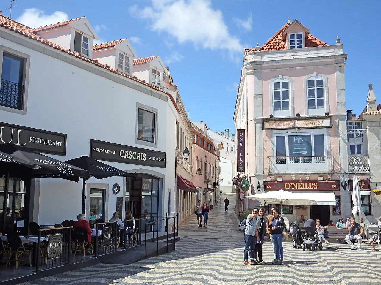 A café-lined pedestrian street in central Cascais.